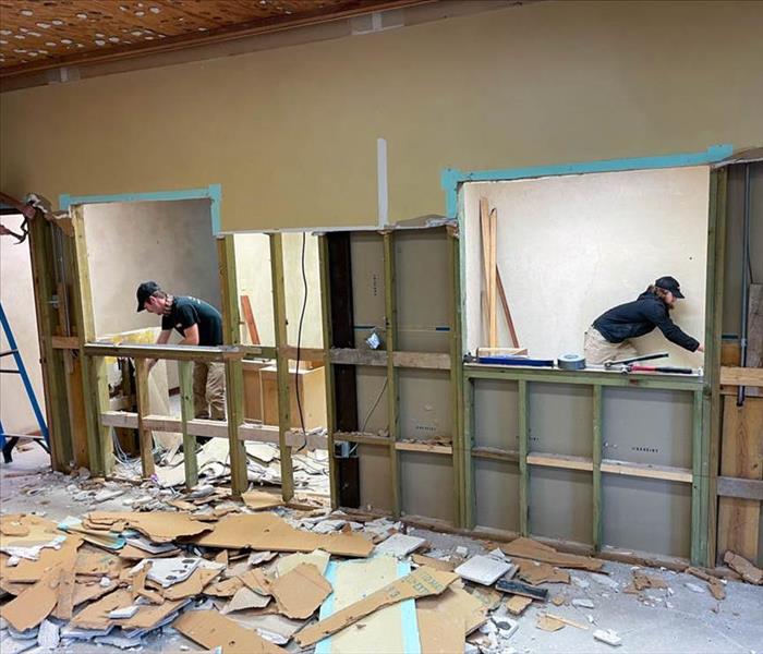 SERVPRO employees restoring room