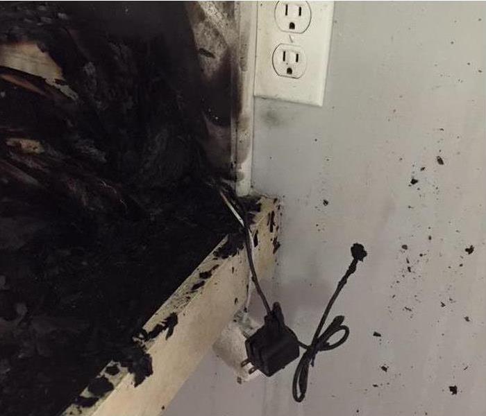 A MAC computer charger cord caused this kitchen fire.